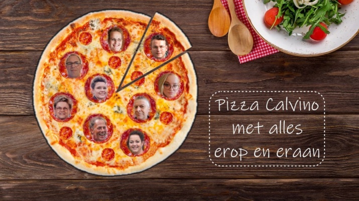 pizza met gezichtjes op houten tafel
